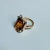 Anillo con topacio naranja y oro amarillo