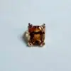 Anillo con topacio naranja y oro amarillo